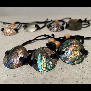 Set of 7 exotic seashell crested silk thread bracelets adjustable w/wooden bead.